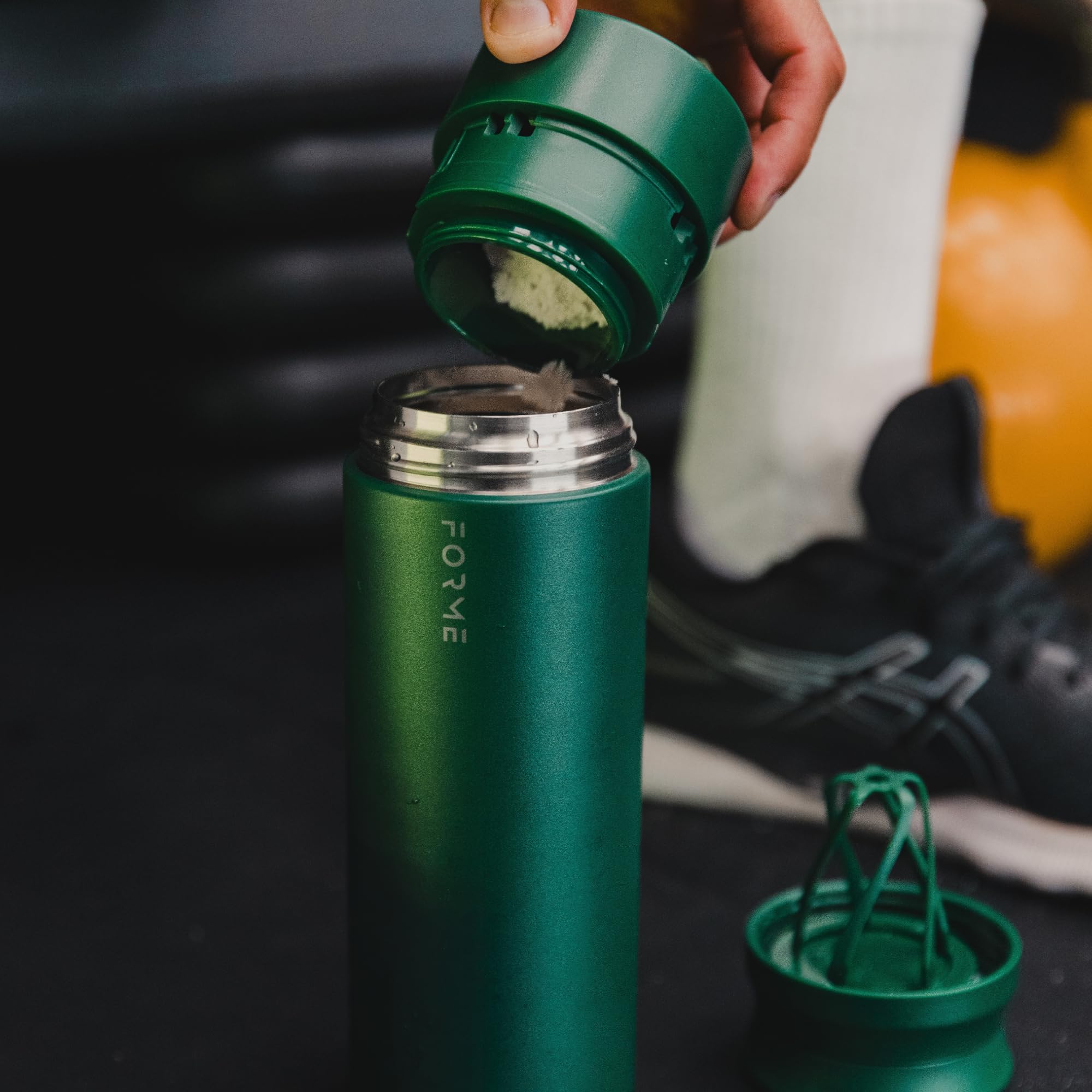 FORME Jungle bottle supplement compartment highlights on-the-go powder storage.