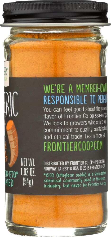 Frontier Co-op turmeric powder on the kitchen counter, enhances color and aroma.