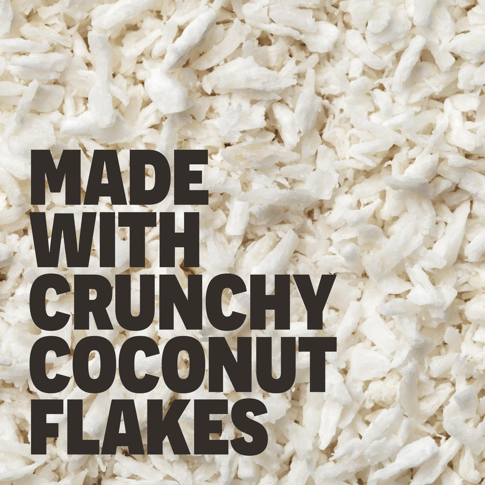FRO PRO coconut bar in hand for quick, protein-rich snacking