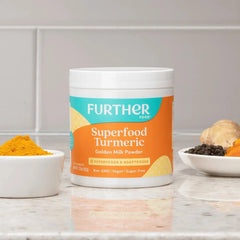 Further Food Turmeric Root Powder ready for tea, releasing aromatic spice notes.