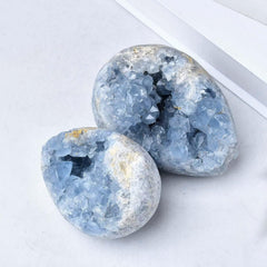 Light reflects softly on the geode, emphasizing the stone's serene color.