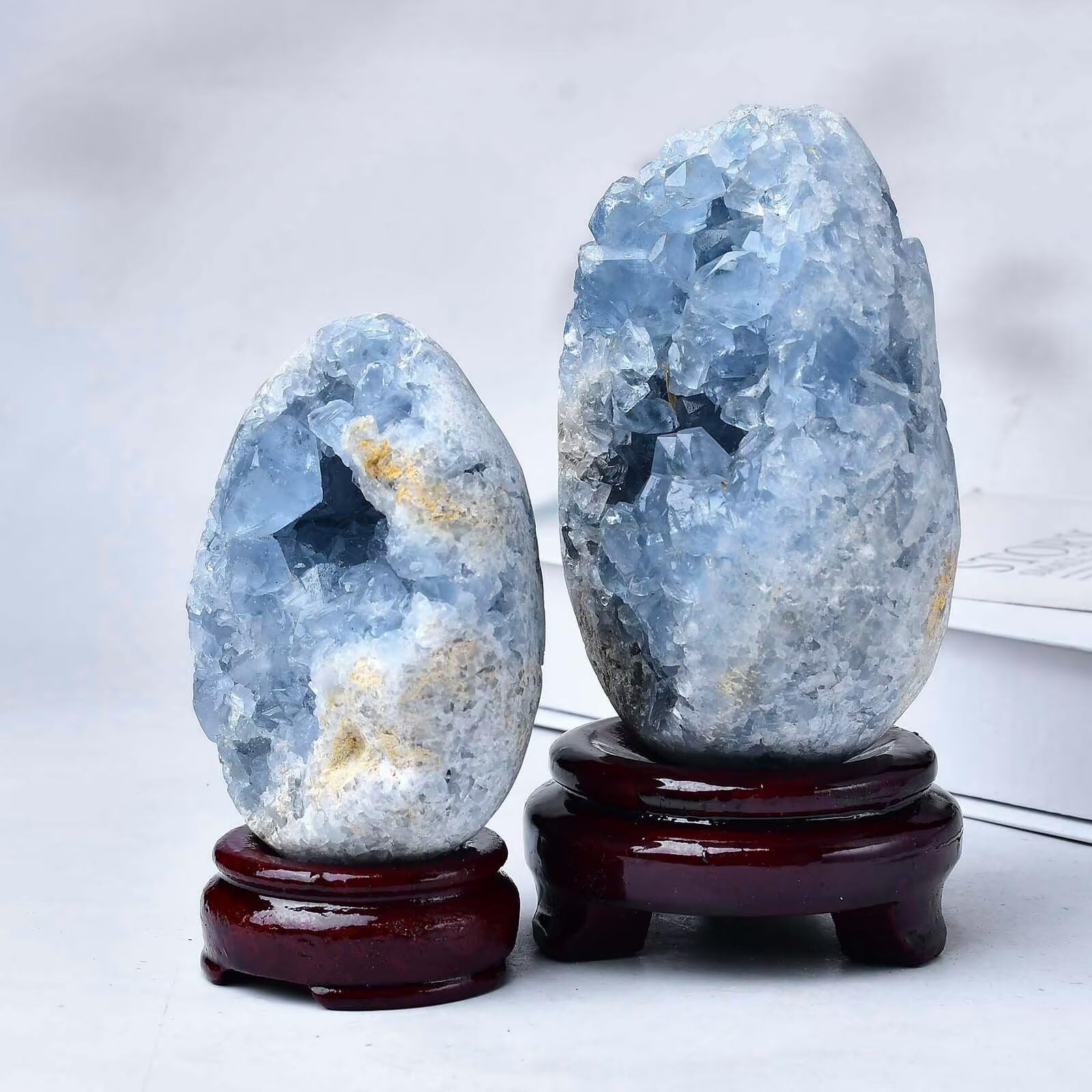 A crystal egg from the FZBHRO collection adds elegant calm to shelves.