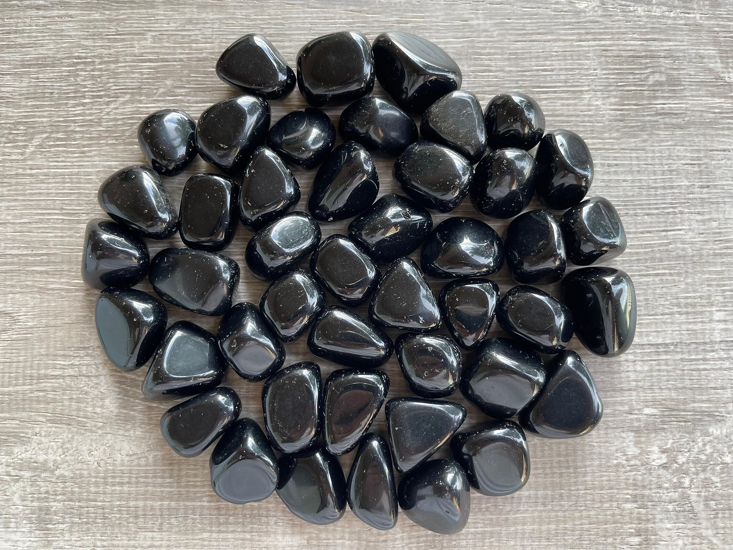 Close-up of glossy GAF TREASURES Black Obsidian surfaces highlighting natural gloss and luster.
