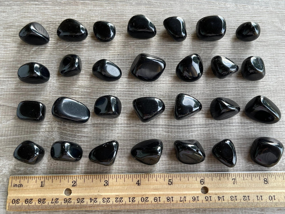 GAF Treasures natural black obsidian tumbled stones for personal collection and energy awareness.