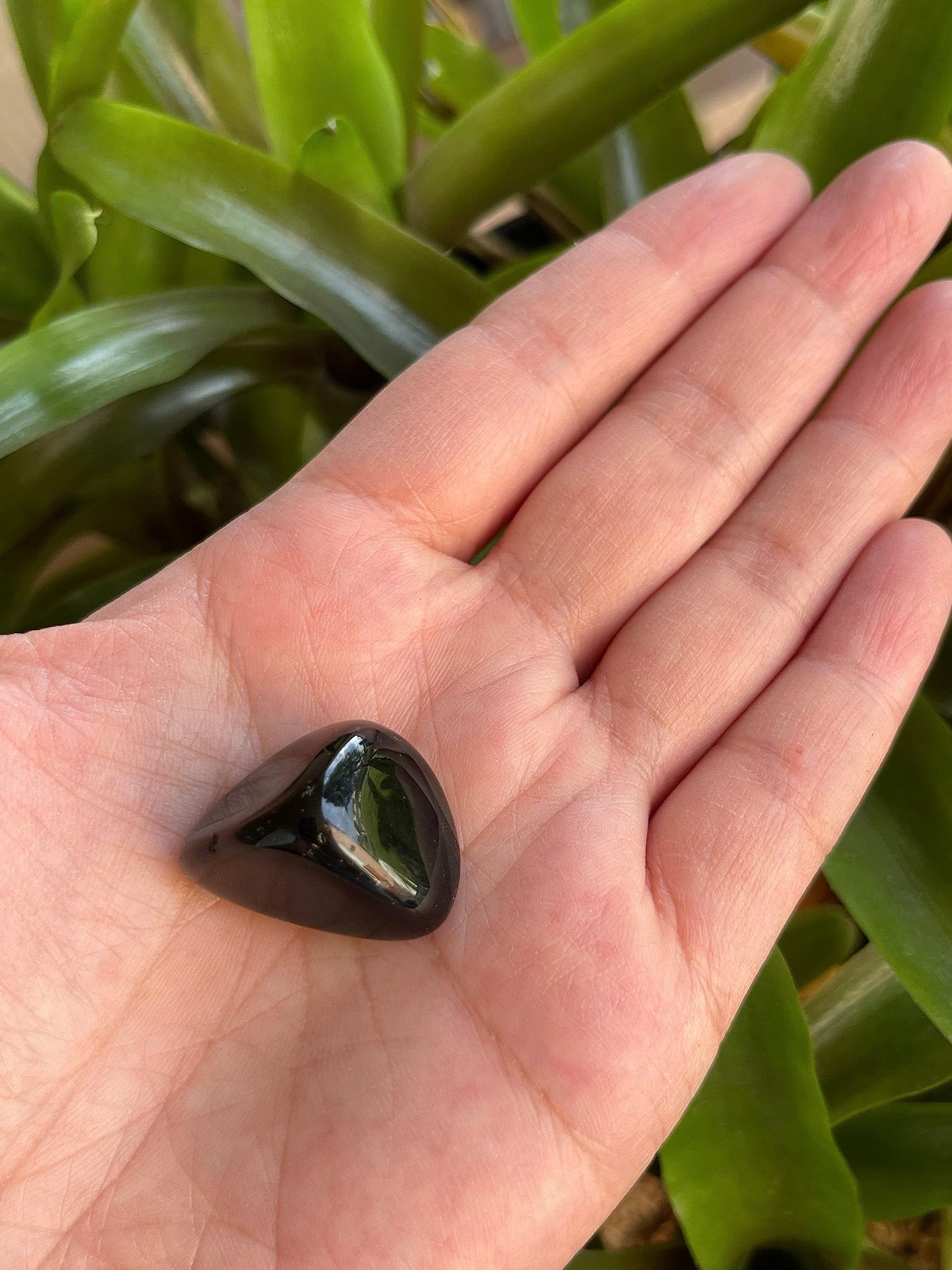 Stones beside a pocket pouch for on-the-go energy focus with GAF TREASURES.