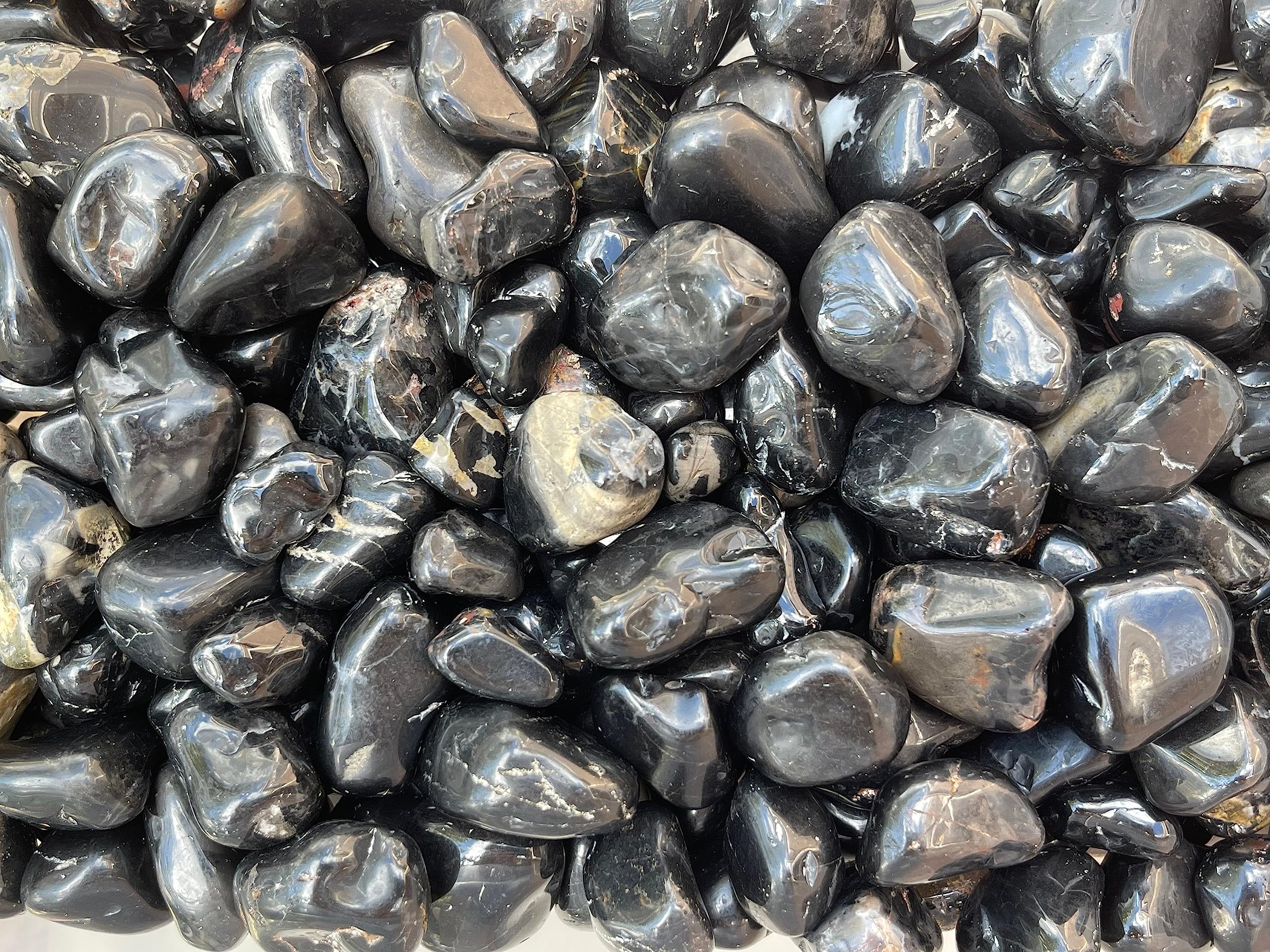 Natural size variation in GAF TREASURES Onyx stones highlighting authentic beauty