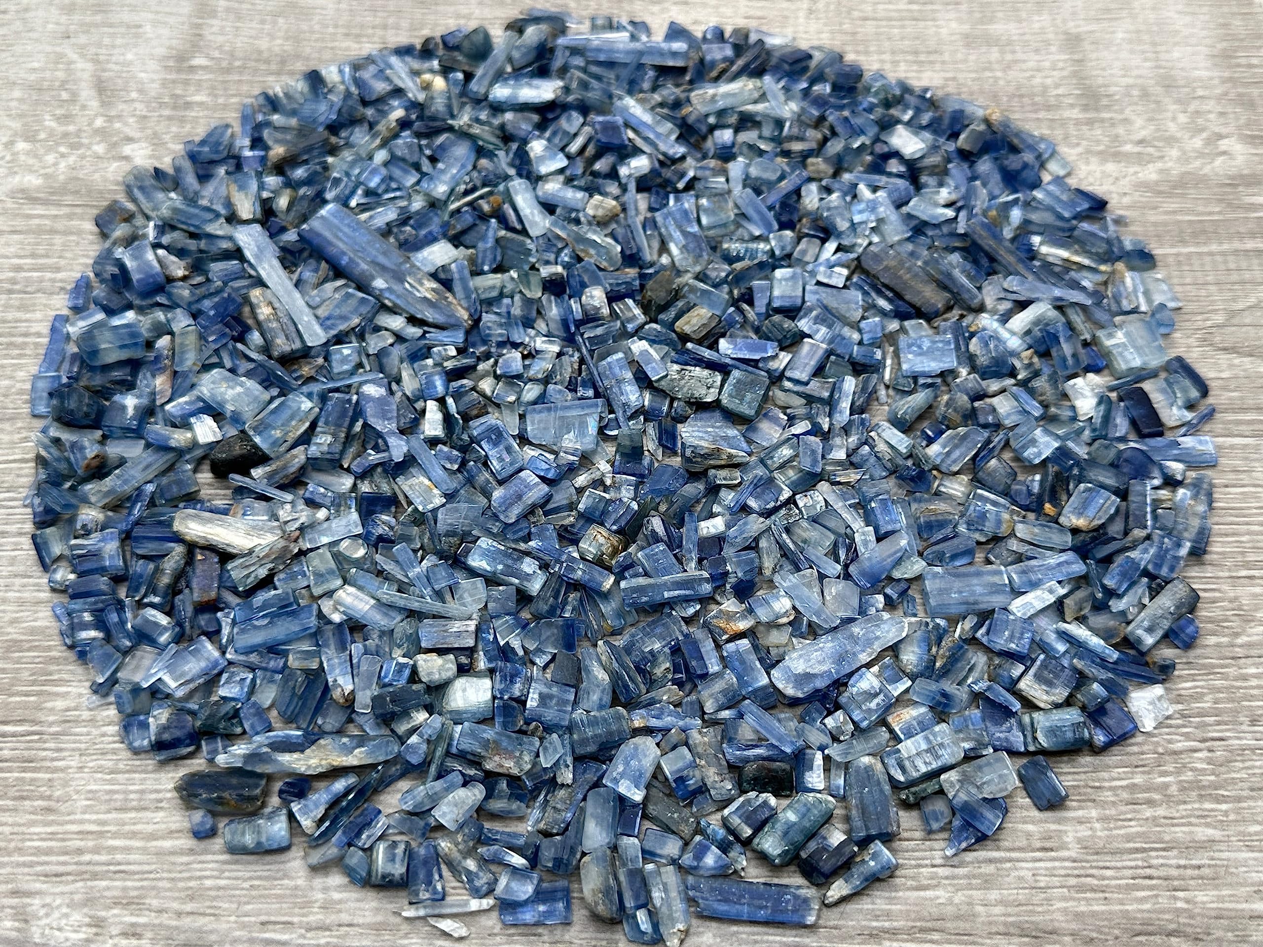 GAF TREASURES blue kyanite chips on display showing color range
