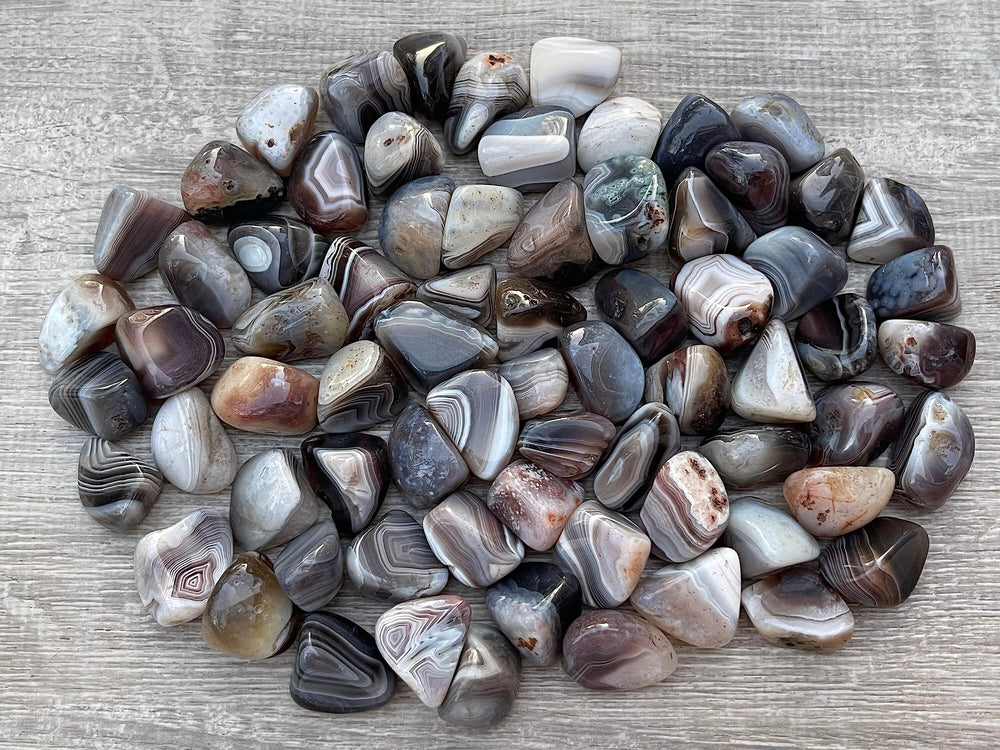 GAF TREASURES Botswana Agate polished gemstones highlighting natural colors for energy balance.