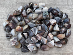 GAF TREASURES Botswana Agate polished gemstones highlighting natural colors for energy balance.