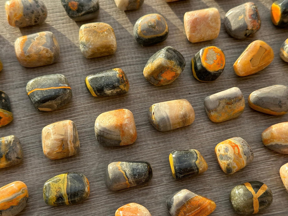 GAF Treasures Bumble Bee Jasper tumbled stones arranged for crystal grid work.