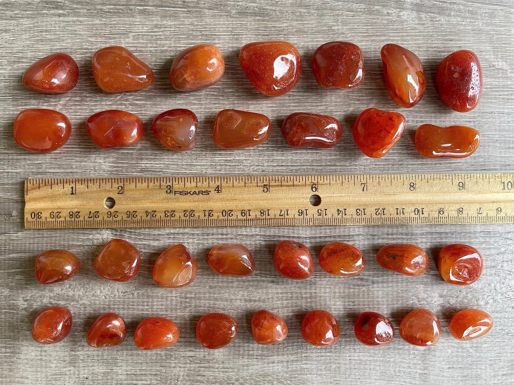 GAF TREASURES Carnelian tumbled stones on grid layout for intention setting and balance