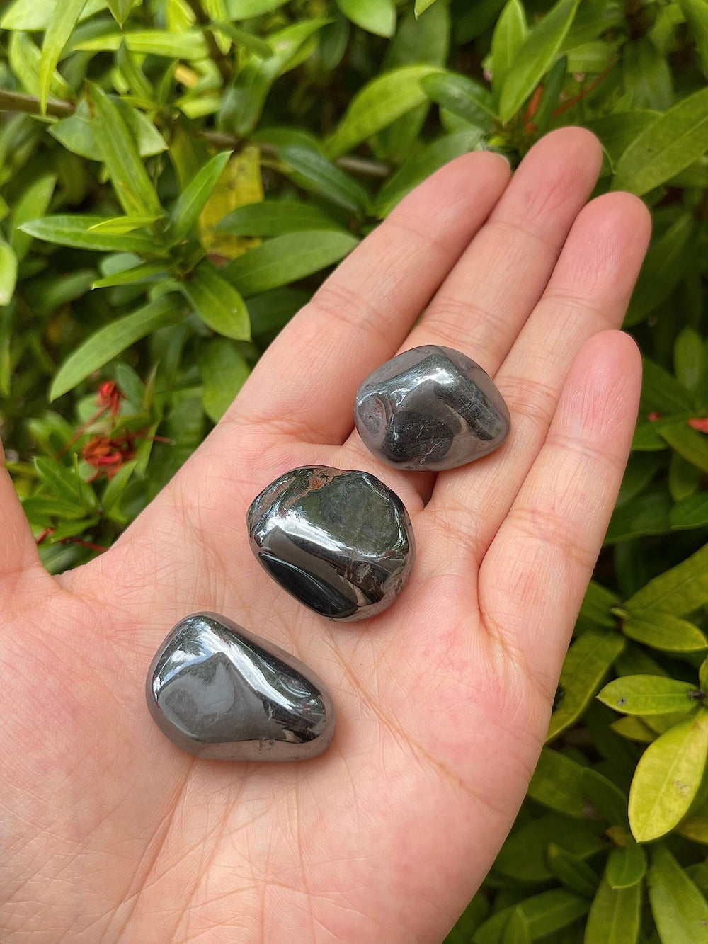GAF TREASURES hematite tumbled stones stacked in a natural pile