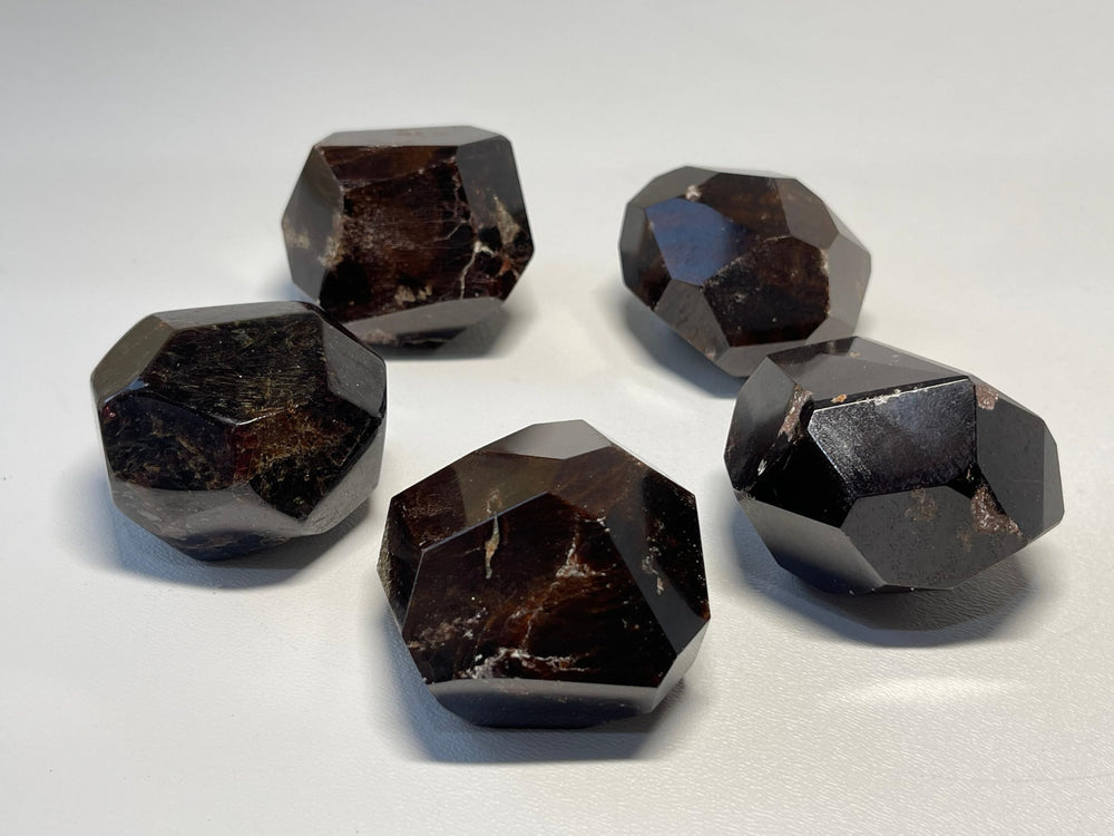 GAF TREASURES garnet polygon polished weight and tactile feel in palm
