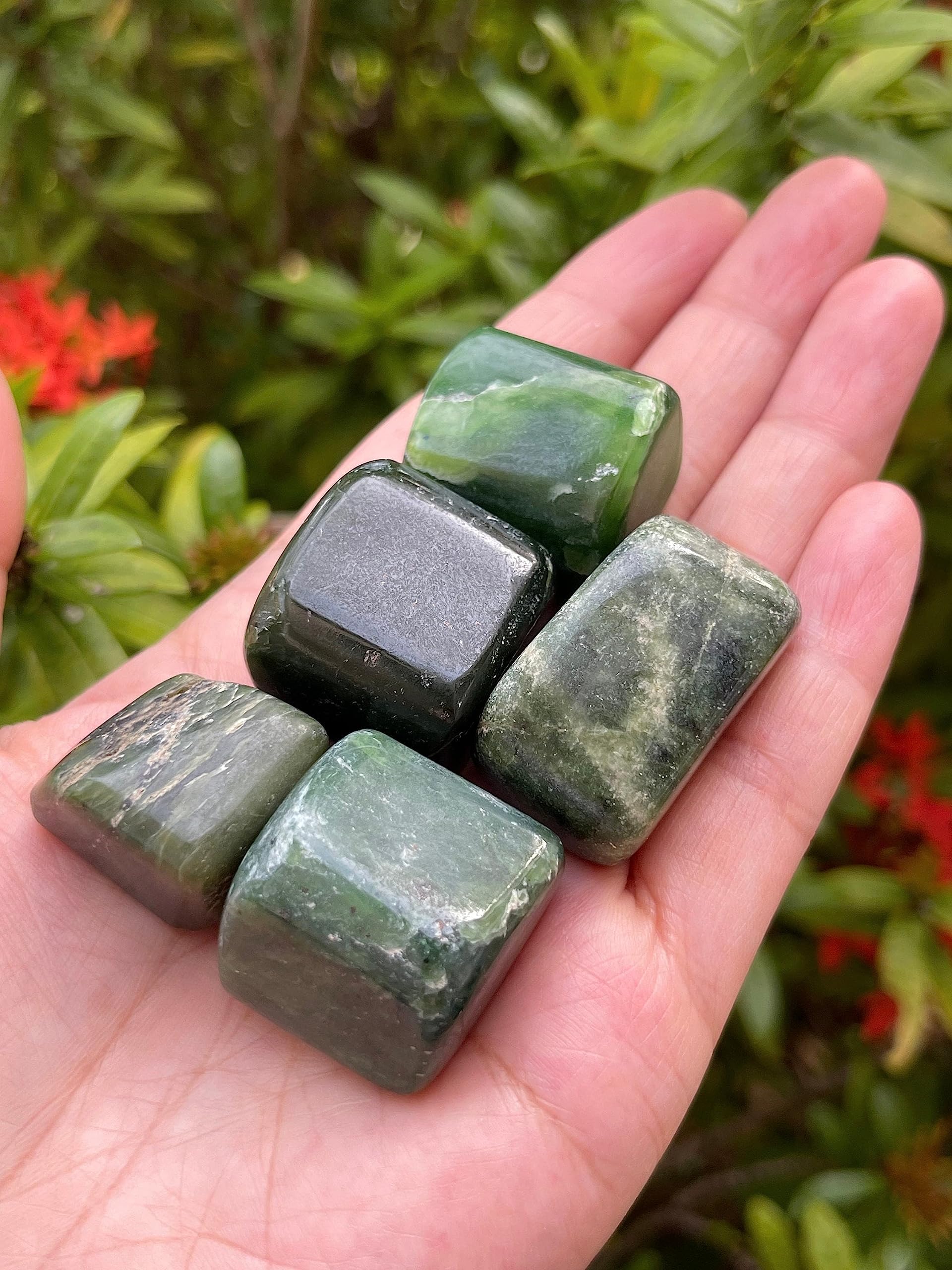 GAF TREASURES nephrite jade stones support decorative grid work and display arrangements.