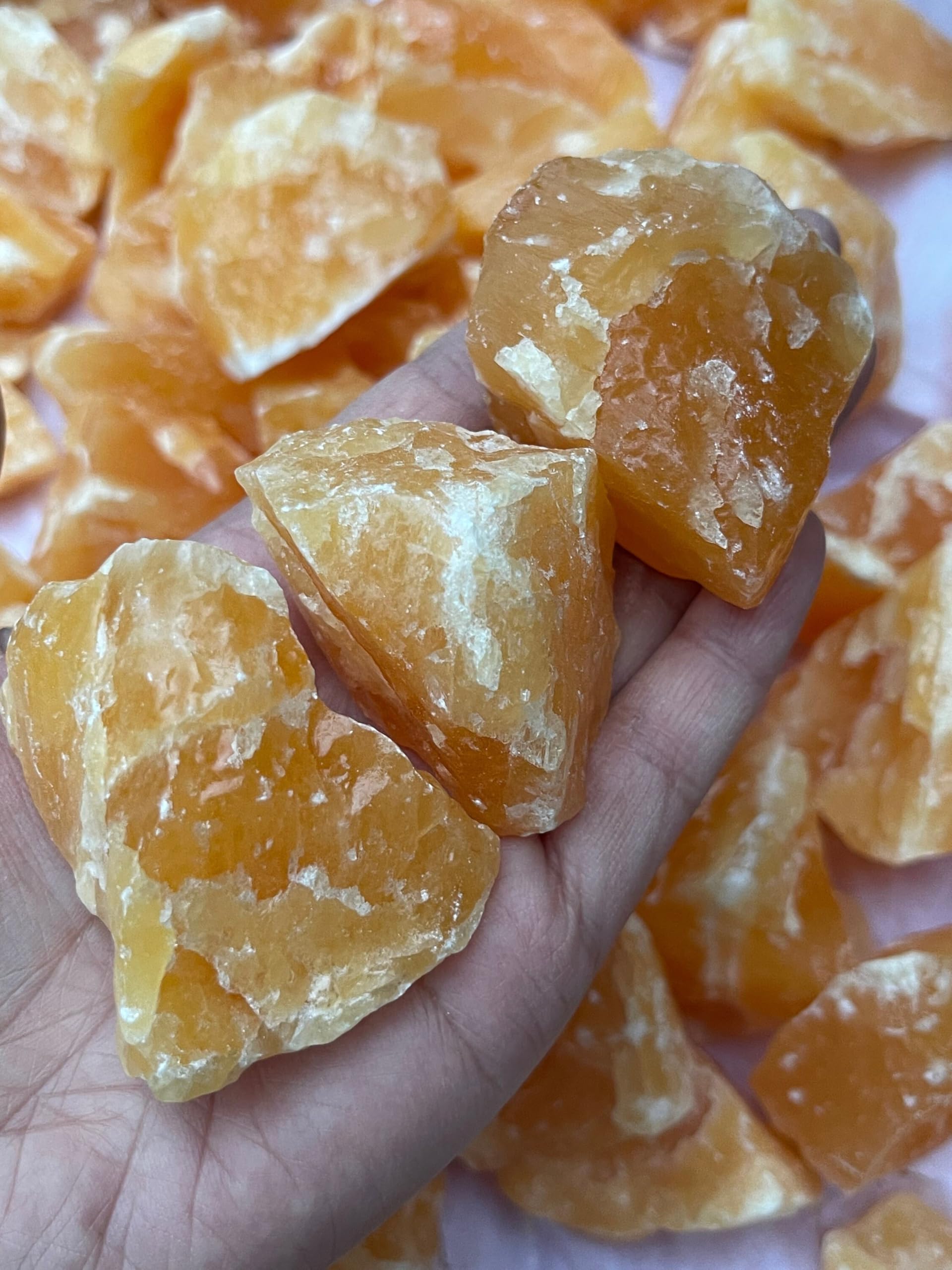 GAF TREASURES orange calcite rough about 2-inch size for tactile handling.