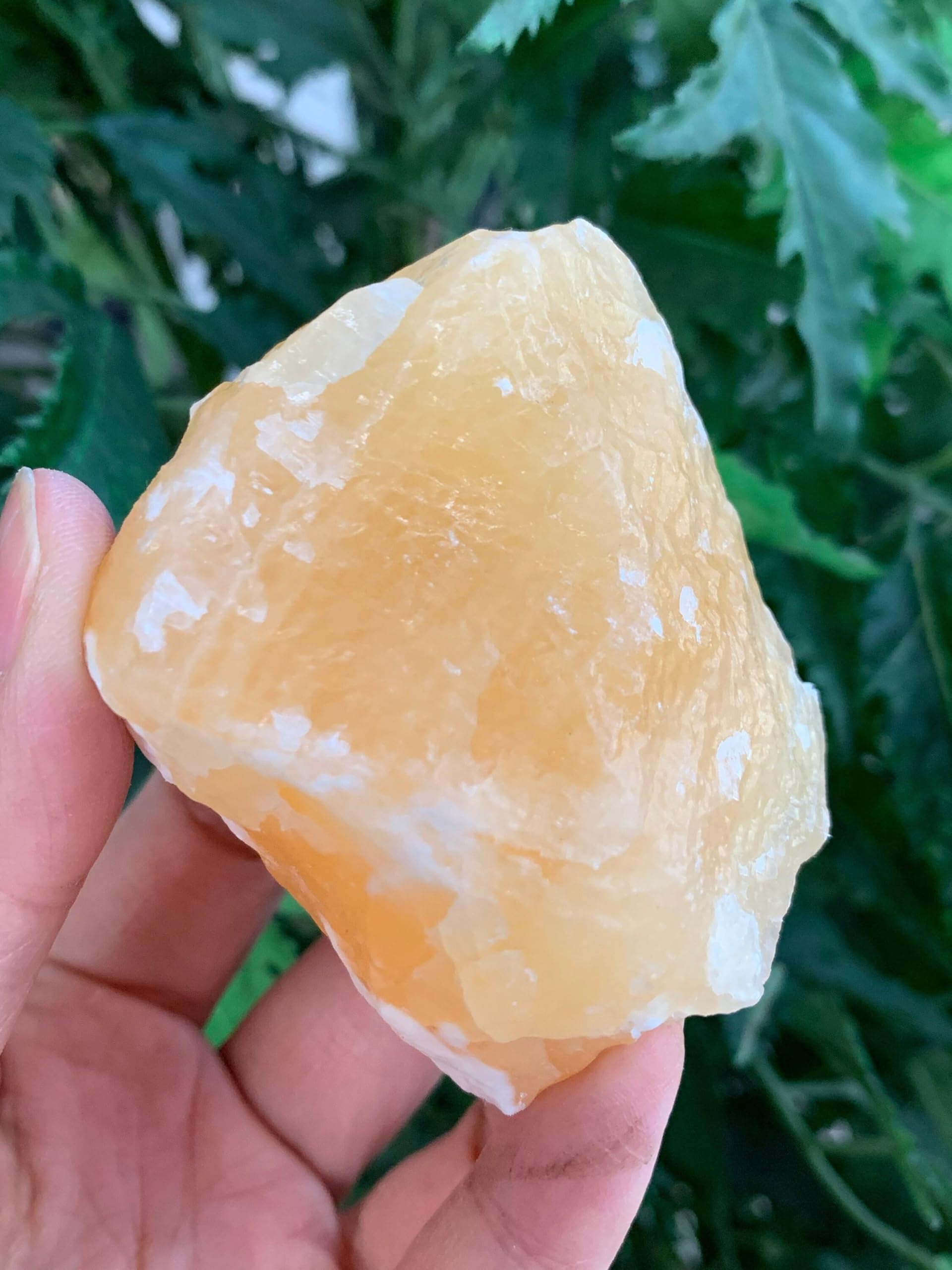 GAF TREASURES orange calcite rough displayed to enhance shelf aesthetics and focus.