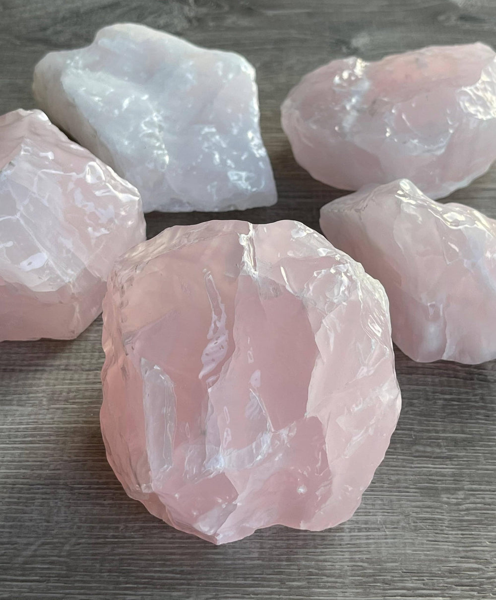 GAF Treasures pink calcite rough for cabbing and polishing with vibrant pink tones.