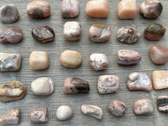 GAF Treasures Pink Opal tumbled stones held in hand during mindful breathing.