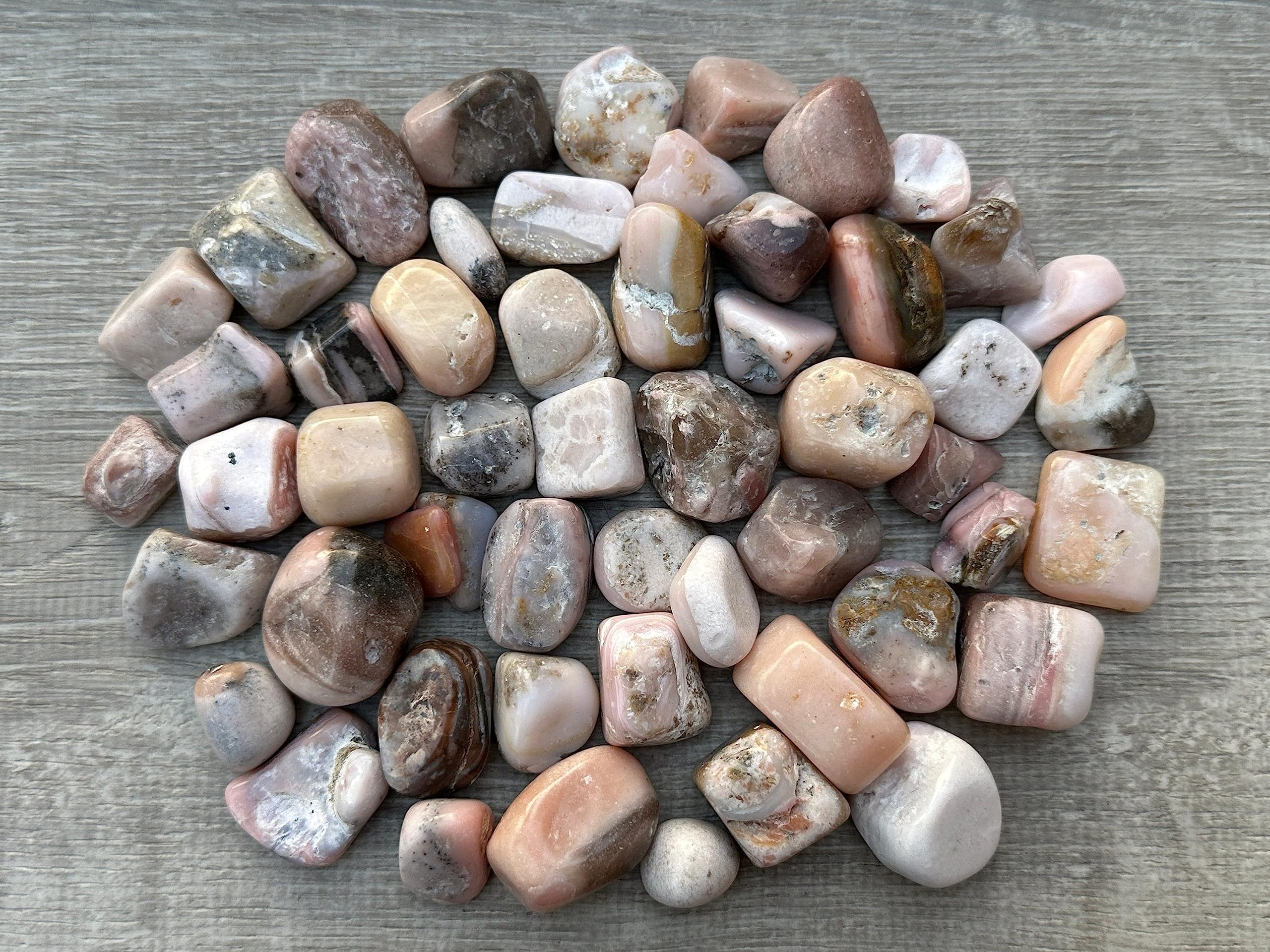 GAF Treasures Pink Opal tumbled stones suitable for yoga and meditation spaces.