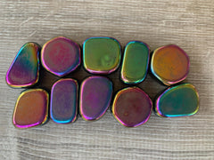 GAF Treasures Rainbow Hematite tumbled stones highlight purple and blue hues for crystal art.