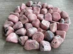 GAF TREASURES Rhodonite stones arranged in a crystal grid layout for therapies