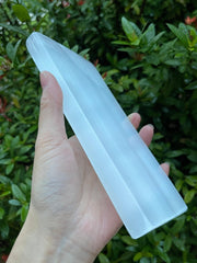 Close-up of polished selenite texture on the GAF TREASURES plate for cleansing crystals