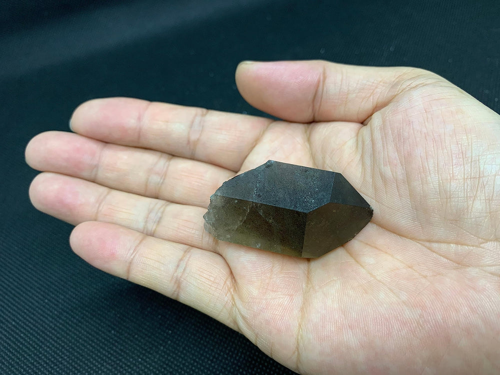 GAF TREASURES smoky quartz points vary in shape and color, showcasing natural beauty.