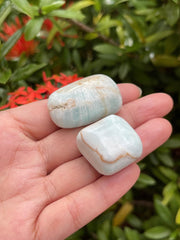 GAF TREASURES Caribbean Calcite polished rocks close-up shows natural druzy texture for display.