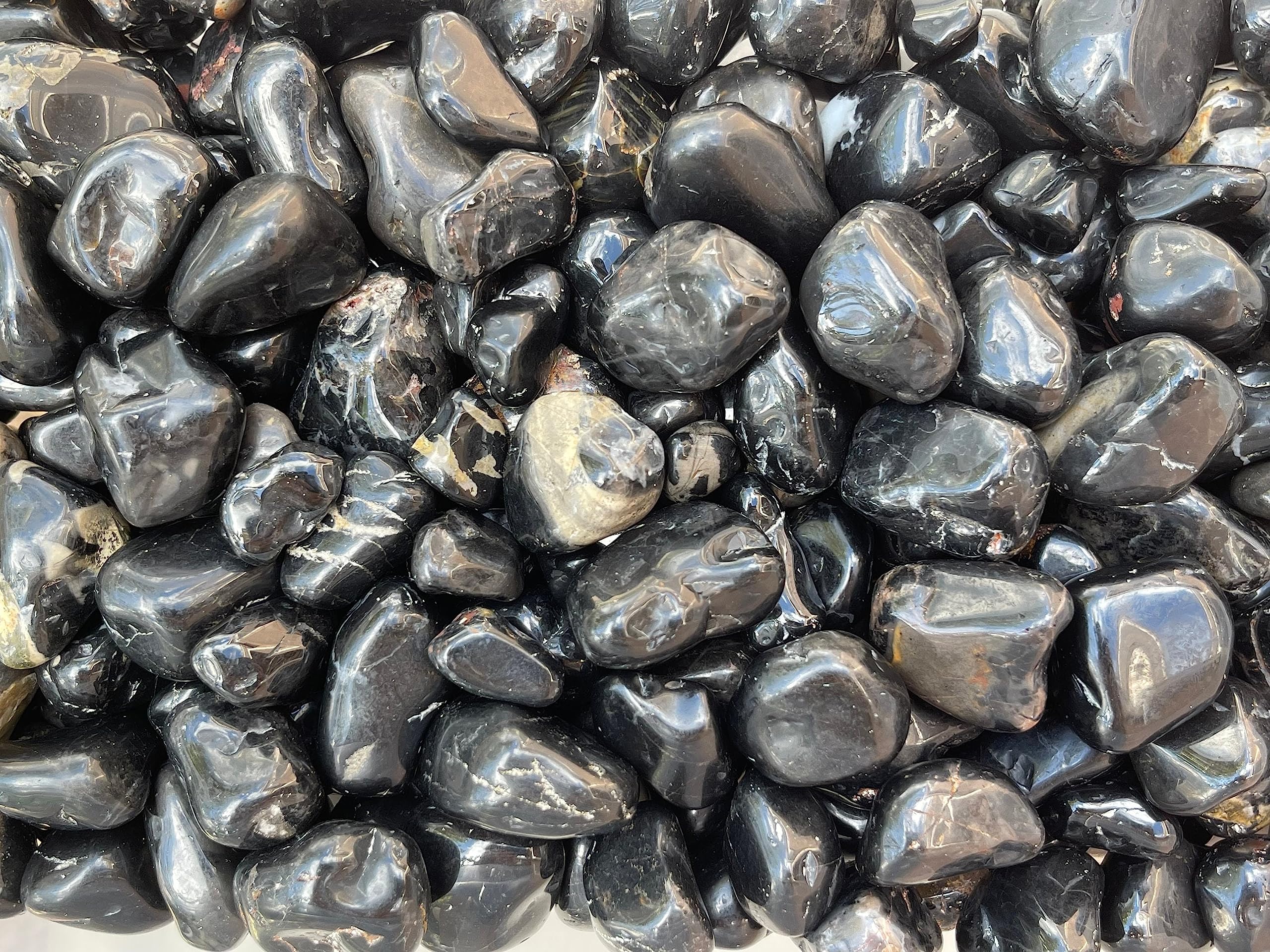 GAF TREASURES natural black onyx with varied patterns and shapes.