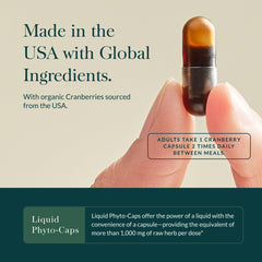 Gaia Herbs Cranberry Concentrate dosage spoon with bottle, showing easy serving.
