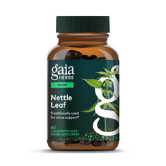 Gaia Herbs Stinging Nettle Leaf bottle on desk, aiding respiratory comfort and immune support.