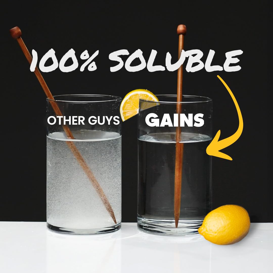 Gains in Bulk 5g scoop beside water highlights precise serving and quick prep