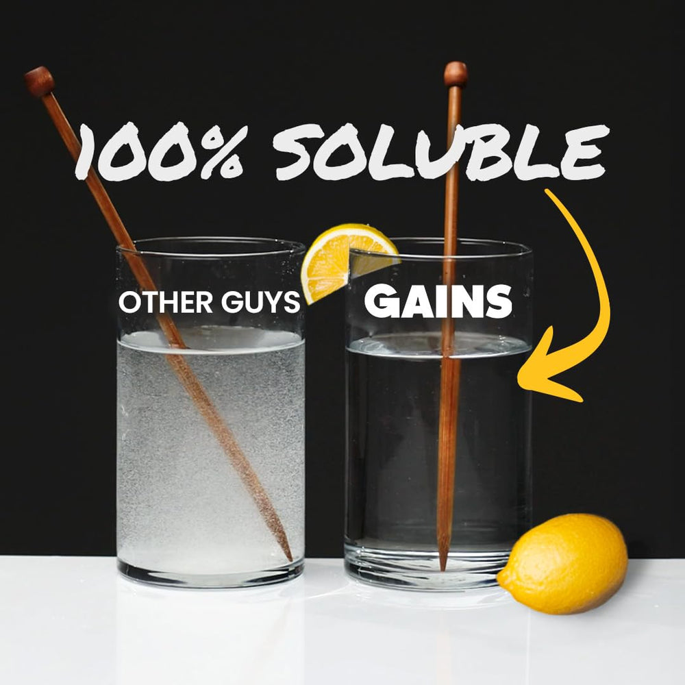 Gains in Bulk 5g scoop beside water highlights precise serving and quick prep