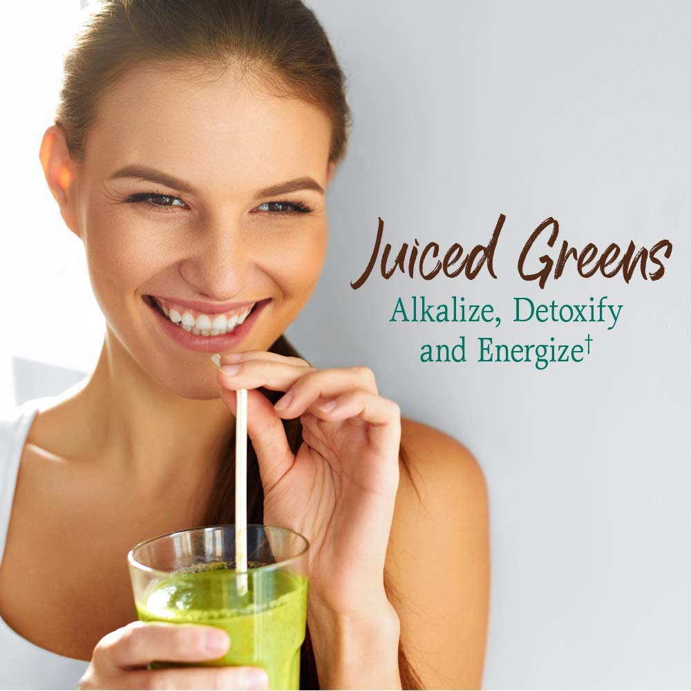 Chocolate powder being poured from Garden of Life greens into a cup