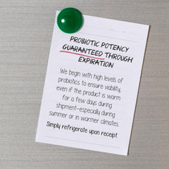 Banana-flavored probiotic powder poured into glass for tasty daily support