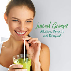 Pouring Garden of Life Super Greens into a glass for veggie boost