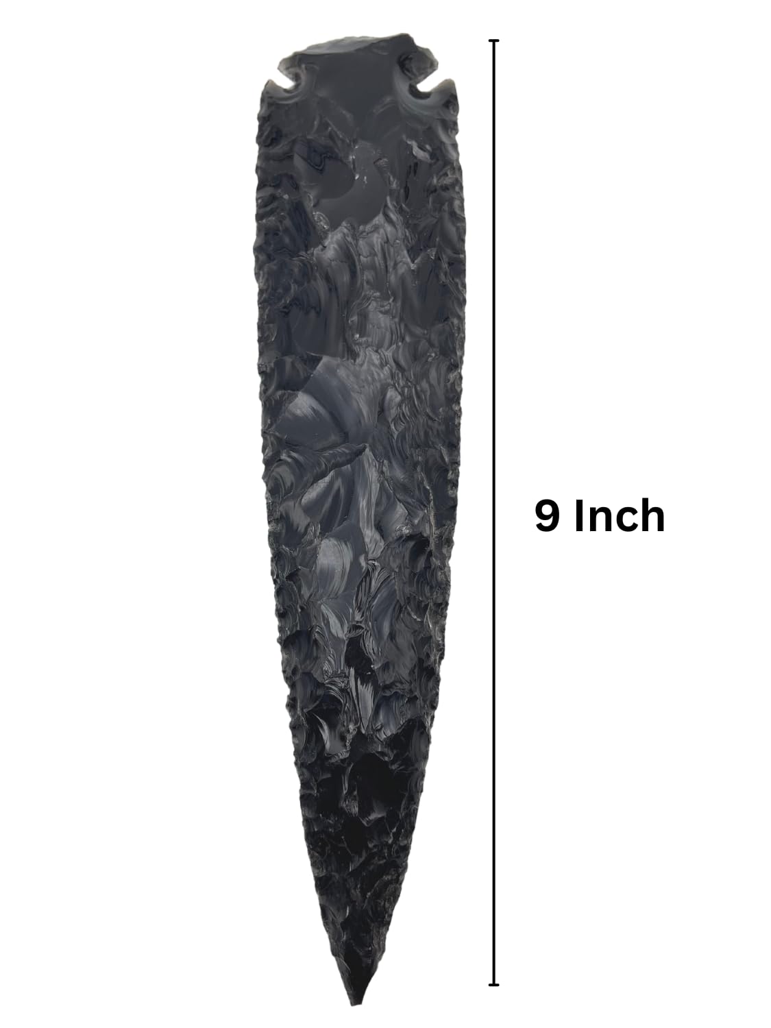 Close up of GEMSCITE obsidian arrowhead showing unique patterns and shine