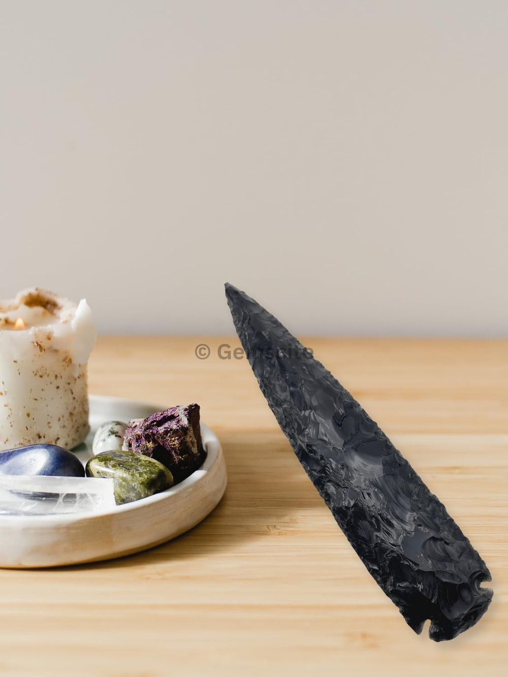 GEMSCITE arrowhead held for scale, perfect for DIY pendants