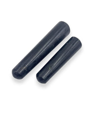Close view shows natural variations in black tourmaline wand for energy work.