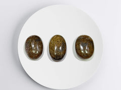 GEMSCITE Bronzite palm stone supporting chakra balancing during daily routines.