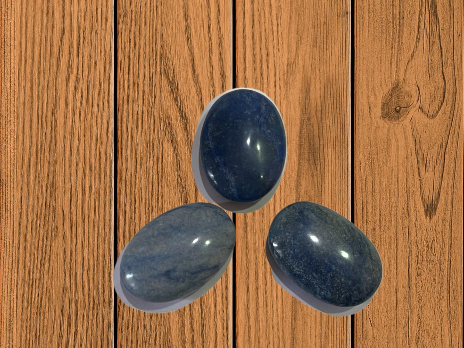 Gemscite Dumortierite palm stone in hand for portable relaxation
