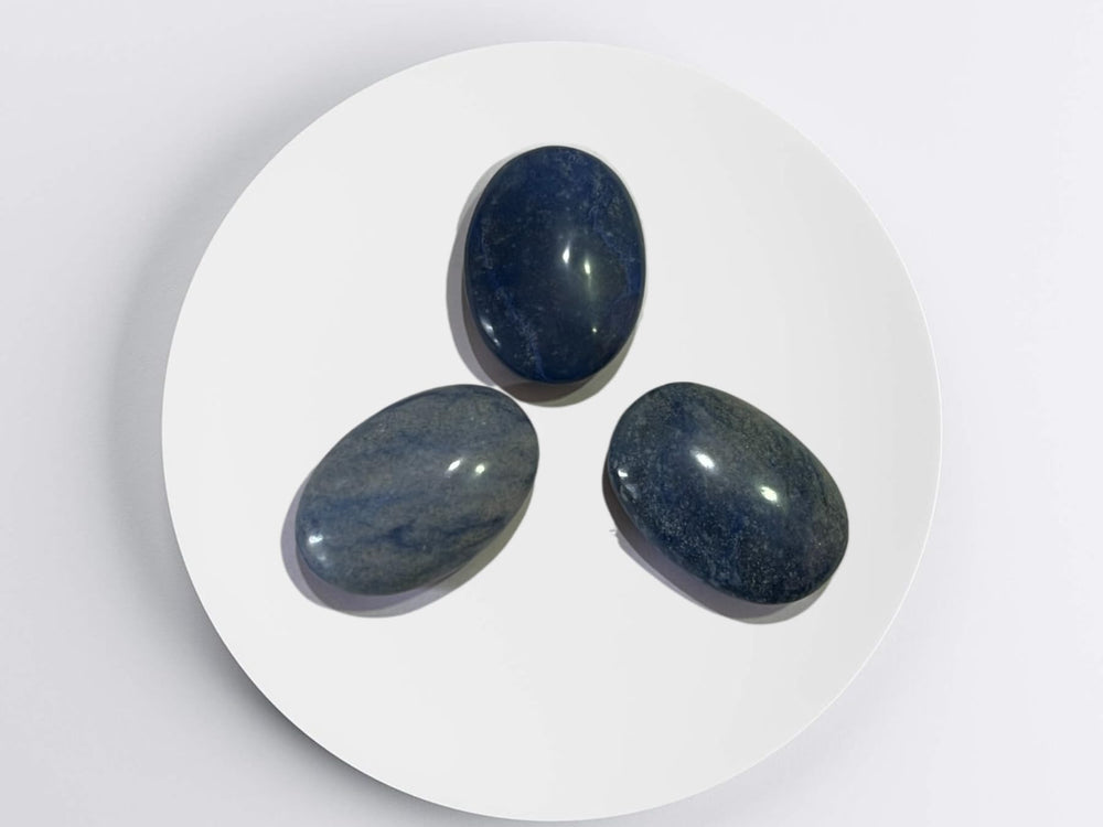 Gemscite Dumortierite palm stone on grid for chakra-inspired energy work