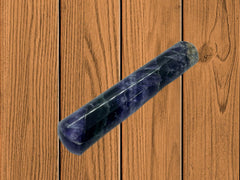 GEMSCITE Flourite wand held during meditation to enhance focus and inner balance.