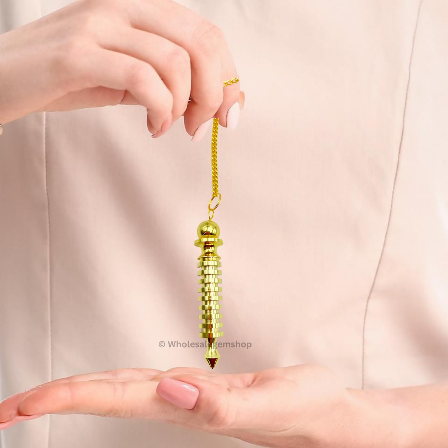 GEMSCITE gilded pendulum with ornate detail for aesthetic and function.