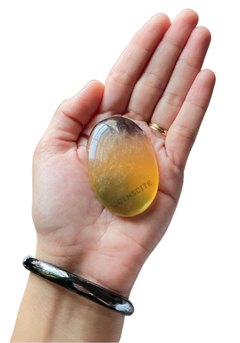 GEMSCITE Multi Fluorite pocket stone on desk inspires calm and clear intention.