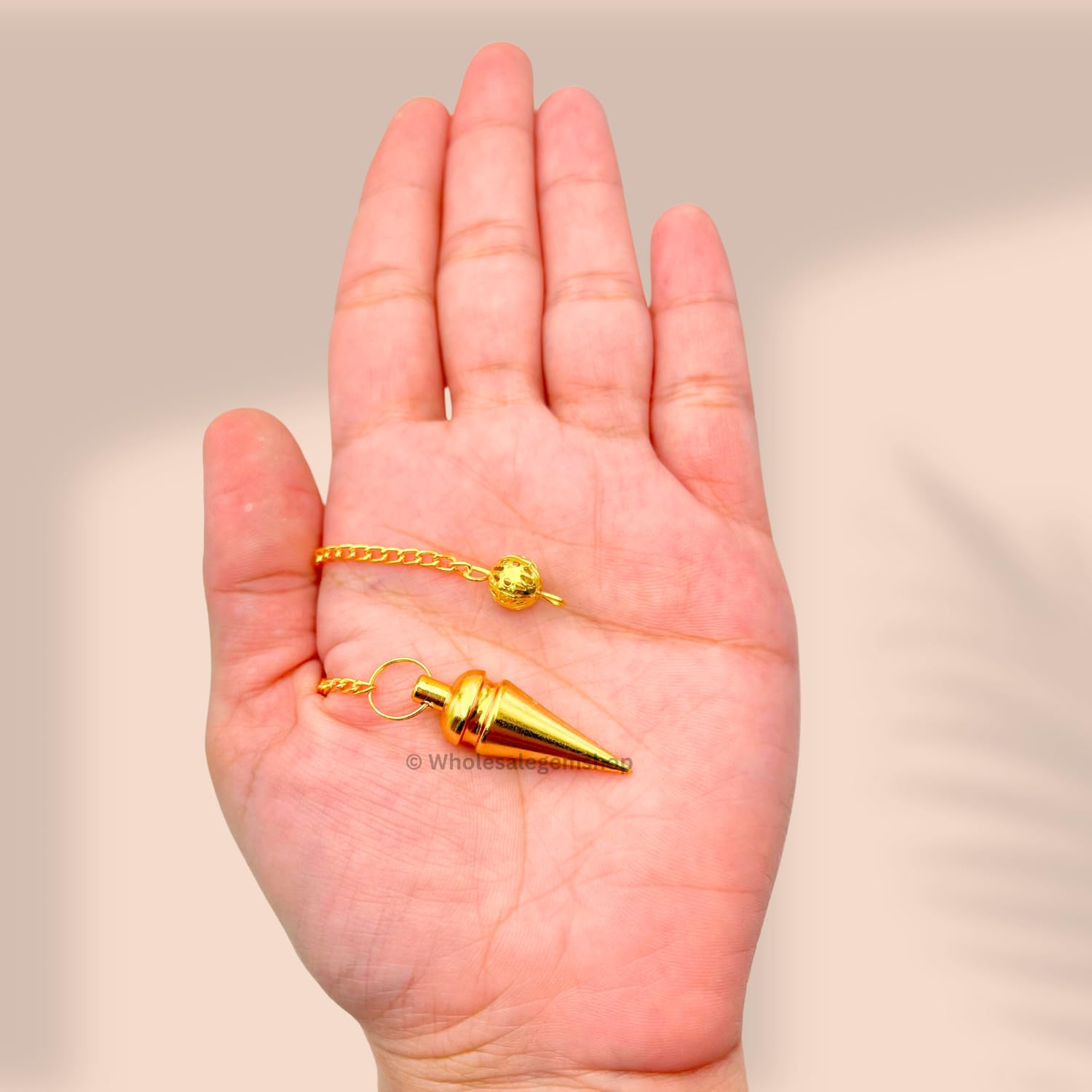 GEMSCITE pendulum with velvet pouch for safe storage.