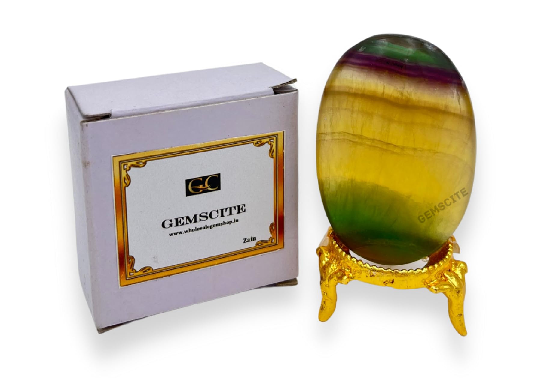 GEMSCITE Polished fluorite palm stone surface reflects hues suitable for grounding.