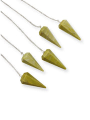 GEMSCITE serpentine pendulum with chain and clear quartz bead during use
