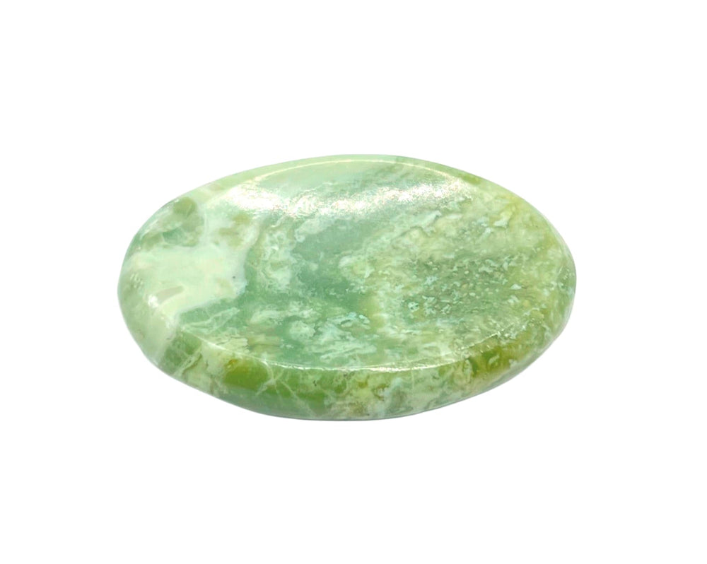 GEMSCITE Serpentine worry stone shows natural color variations.
