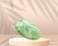 GEMSCITE Serpentine worry stone in its pouch for portable serenity.